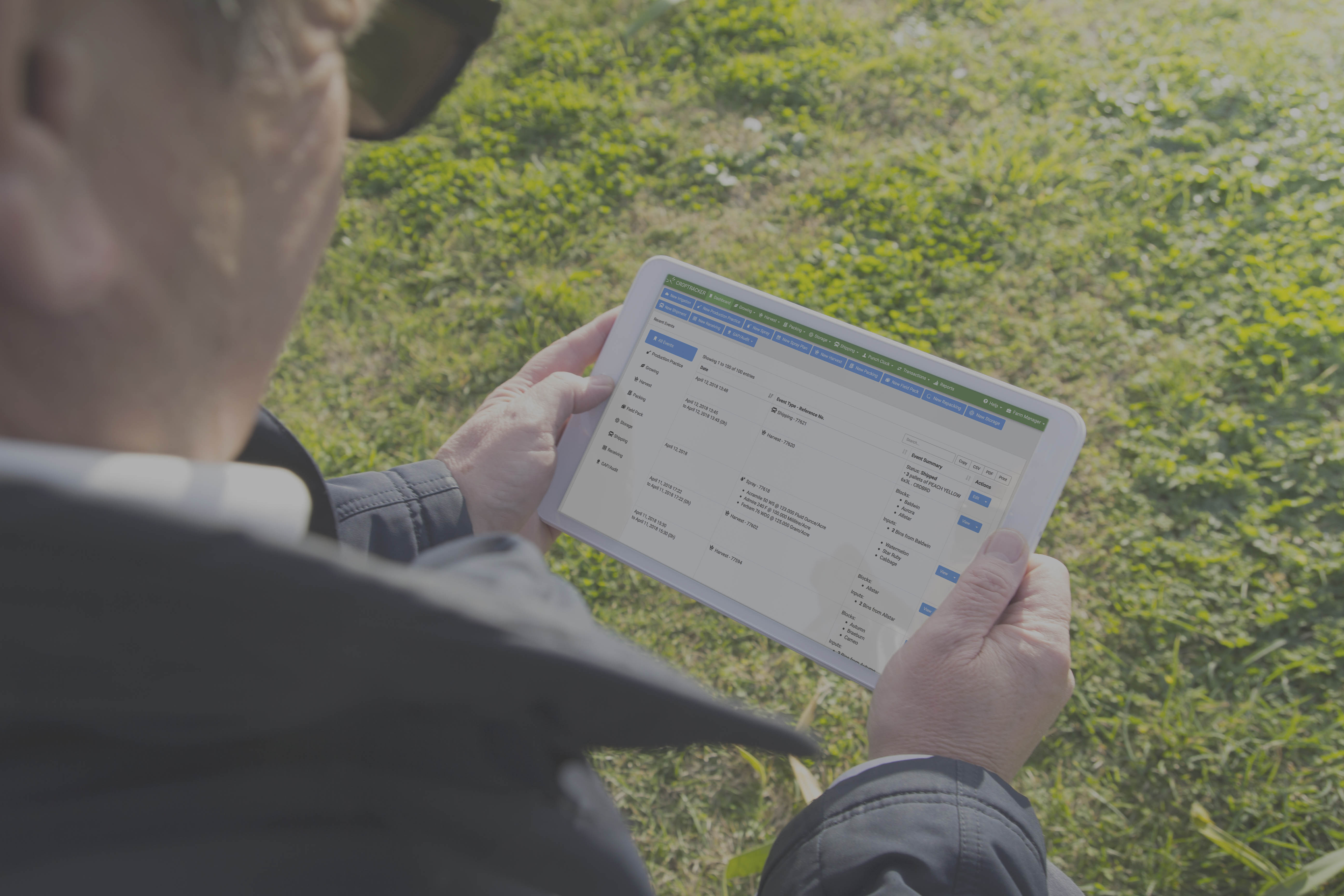 Grower using mobile farm management app for labor tracking in apple orchard field